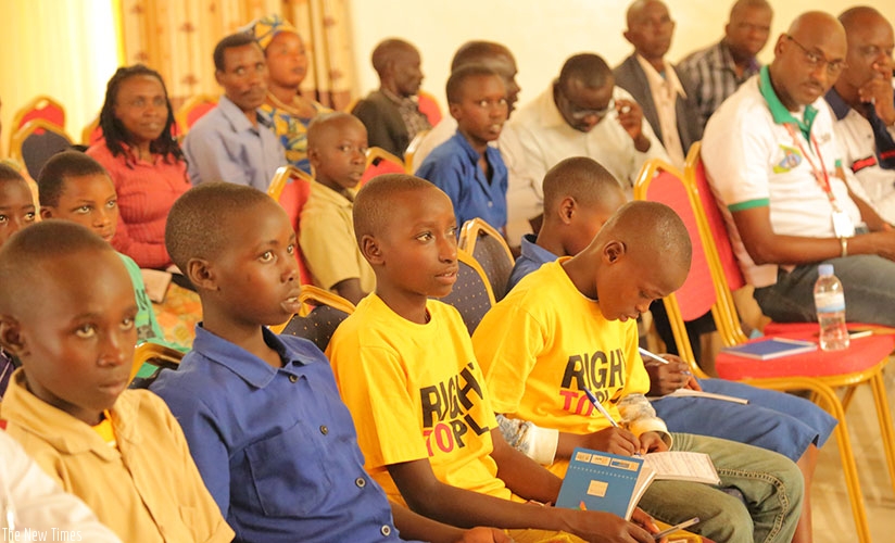 Children and their parents during the meeting. Olivier Muragijimana