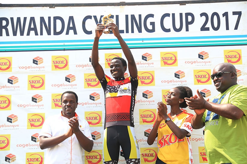 Patrick Byukusenge holds his trophy aloft as the 2017 Rwanda Cycling Cup champion on Saturday. Sam Ngendahimana.