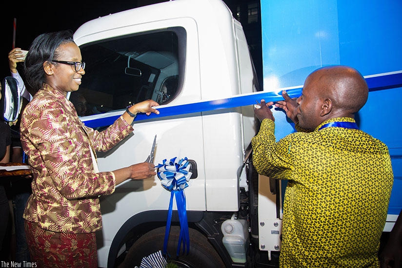 BK CEO Karusisi hands over a lorry worth Rwf38 million to Munyakayanza. F. Niyigena.