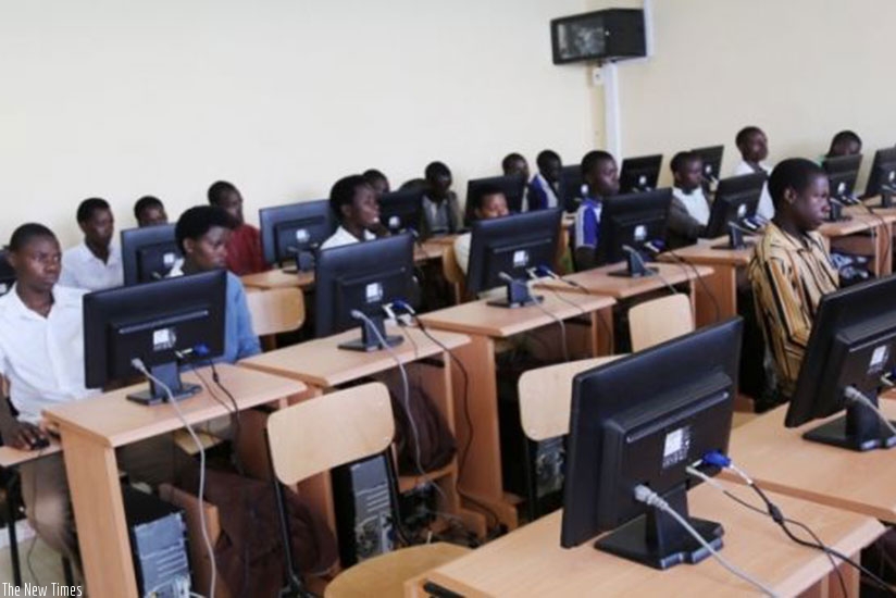 Students using computers in a Community Knowledge Centre. File.