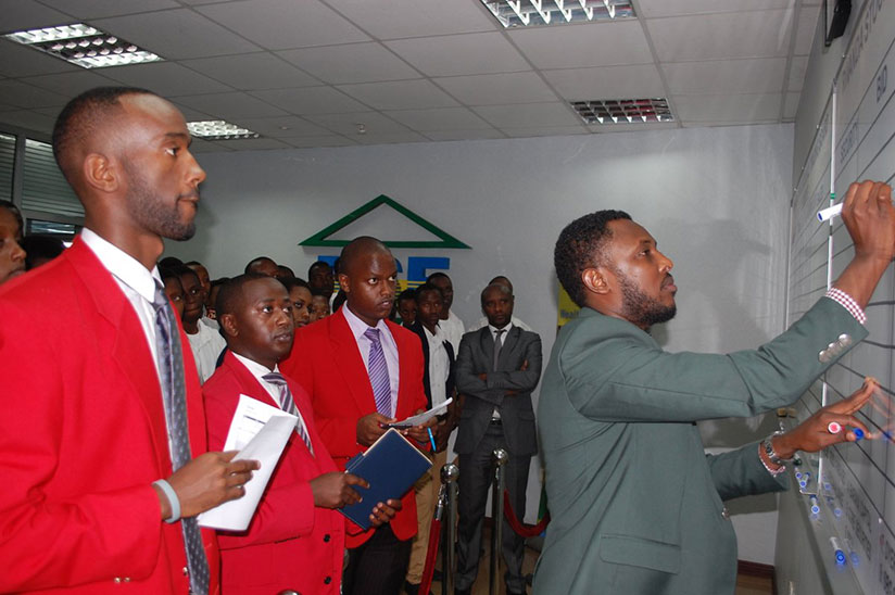 Dealers during a trading session at the local exchange. The bourse performance inched up last year, recovering from periods of poor runs over the previous years. / File