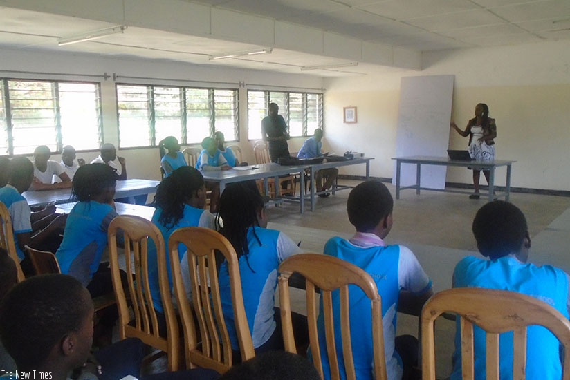 A mentor talks to students about the importance of setting goals and developing a work-plan.  (Lydia Atieno)