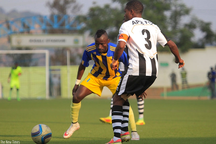 Shaban Hussein Tchabalala tries to go past APR FC captain Albert Ngabo in a past match at Kigali Stadium. (Sam Ngendahimana)
