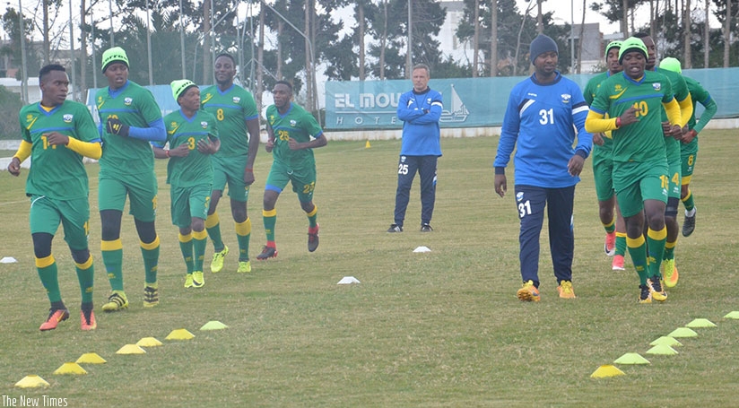 Amavubi assistant coach Mashami taking the players through their paces in Tunisia on Wednesday as head coach Hey looks on in the background. Courtesy