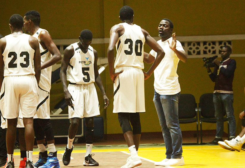 Patriots coach Henry Mwinuke gives instructions to his players during the league match against REG last Friday. / Sam Ngendahimana