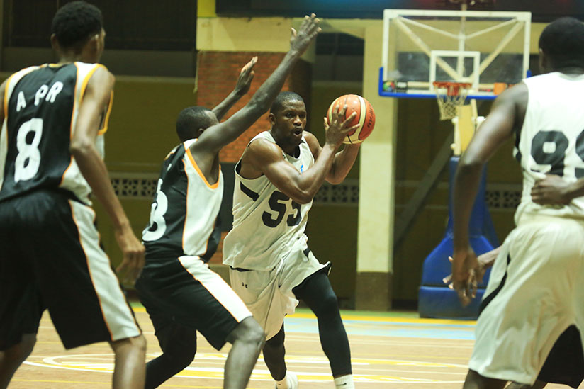 Patriots' Power Forward Junior Kasongo, on the ball, scored a game high 16 points to lead Patriots to a 65-52 win over  APR. / S. Ngendahimana