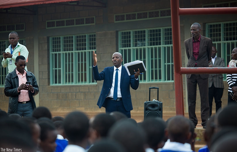 Michael Tusiime, the deputy director in charge of examinations and accreditation at Rwanda Education Board speaks to PLE candidates before the start of exams last November. (File)