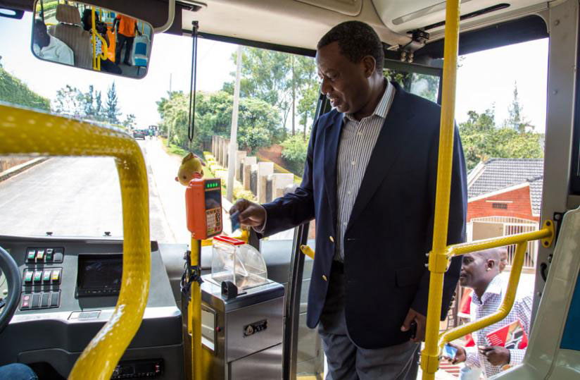 A passenger swipes his Tap & Go card upon boarding a bus. 