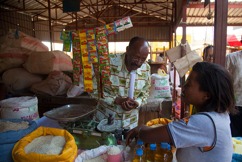 MP Emmanuel Mudidi speaks to a vendor at Gahanga market in Kicukiro during a past countrywide tour by the lawmakers. / File