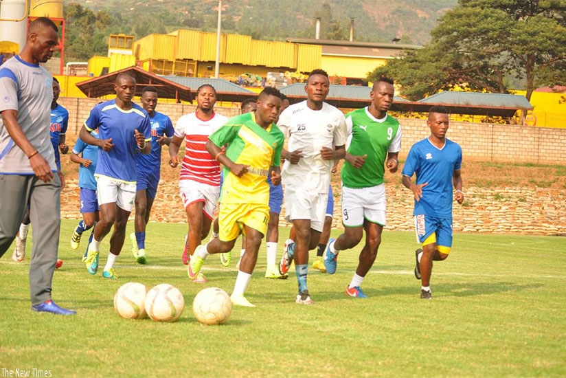 Modeste Eboa, Christian Moshi (Virunga), and Massia Bilombe leading the warm up on Monday training. P. Kamasa. 