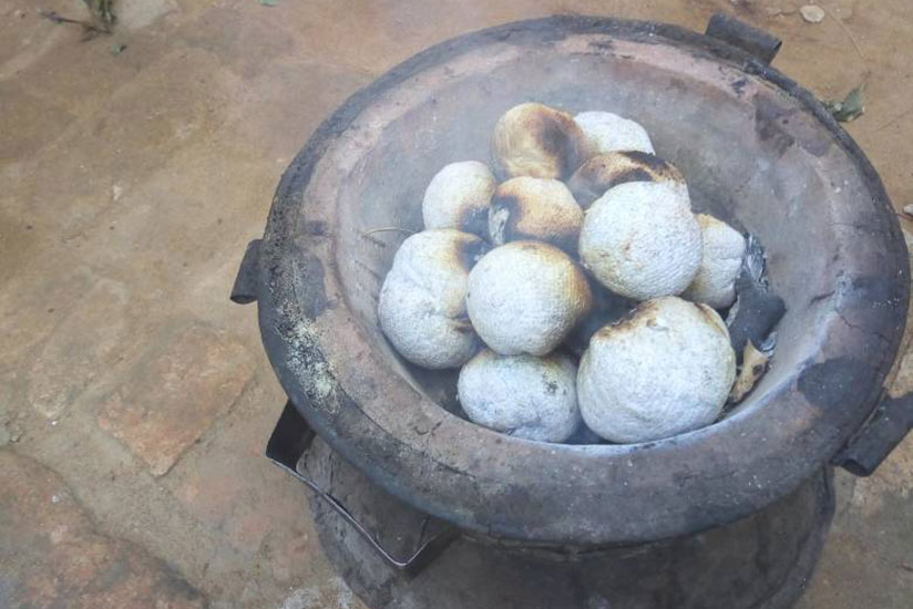 Paper charcoal being used to cook on a stove.