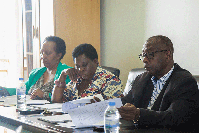 Senators go through documents during a meeting recently. Nadege Imbabazi. 