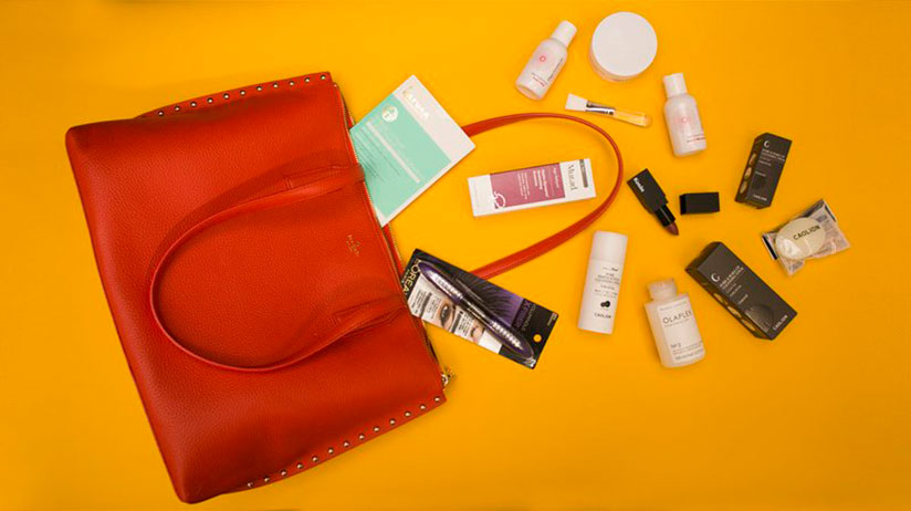 Kate Spadeu2019s Made in Rwanda handcrafted tote bags filled with makeup and beauty products. Courtesy photos.