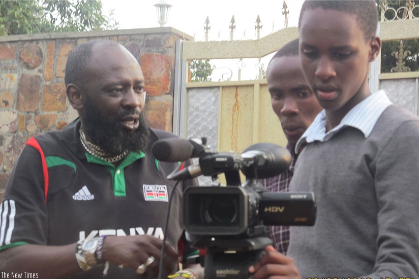 Samuel Ishimwe Karemangingo (R) with a film crew at the set. (Courtesy photos)
