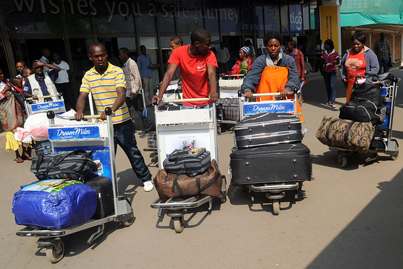 Rwandan returnees from Malawi on arrival at Kigali International Airport in August 2013. File.