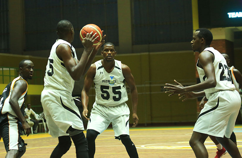 Patriots' new forward Micheal Makiadi looks to pass the ball to Junior Kasongo (#55) during the last league game against APR. / Sam Ngendahimana
