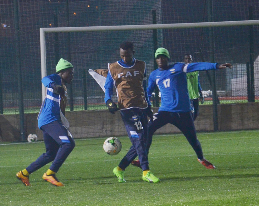 Amavubi vice-captain Bizimana, left, seen here in training on Friday night, has declared that they are in Morocco to compete with the aim of getting out of Group C. / Courtesy