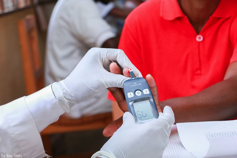 A medic screens a patient. Check-ups for school-going children prevents spread of diseases. / Lydia Atieno.