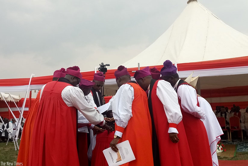 Anglican Bishops pray for-Rev. Musabyimana after his consecration.  Jean d'Amour  Mbonyinshuti.
