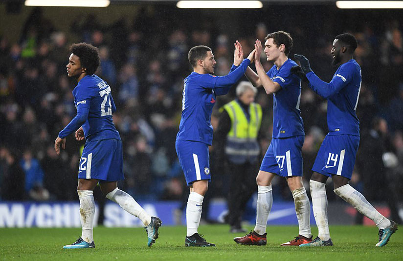 Eden Hazard, who came on as substitute in the first half of extra time, is congratulated by his team-mates following the win. / Net photo