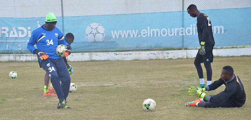 The Amavubi captain, Eric Ndayishimiye, seen here in training with goalkeeping coach Thomas Higiro, says the team is in  high spirits to get a result  against Eq. Guinea. / Courtesy