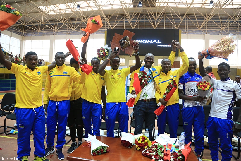 Team Rwanda celebrate their success shortly after jetting back home on Tuesday. File.