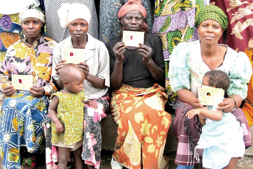 Mothers with Mutuelle cards await for medical service at a health facility. File.
