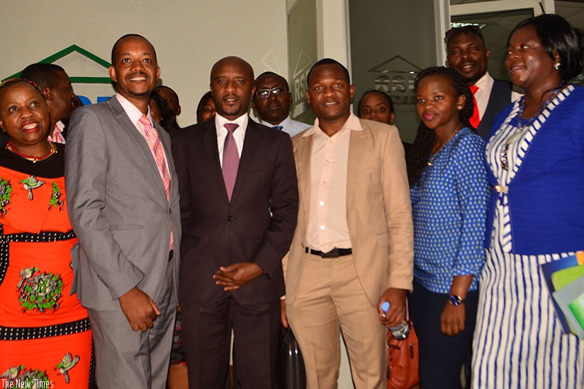 Rwabukumba (third left) pose for a group photo with visiting Zimbabwean business delegation. The Zimbabweans expressed interest to invest on local bourse. / Frederic Byumvuhore.