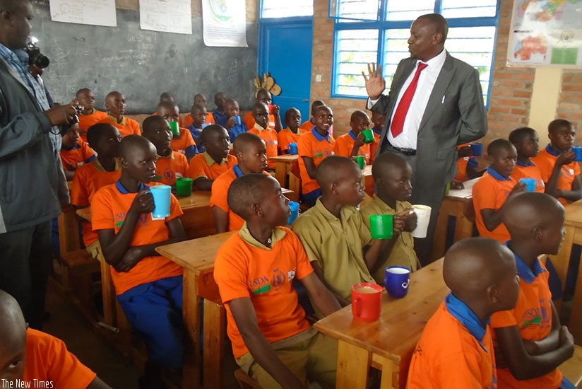 Pupils at Sanza Primary School taking break tea. Such school programmes should be all inclusive  to avoid challenges such as school drop-outs. (File)