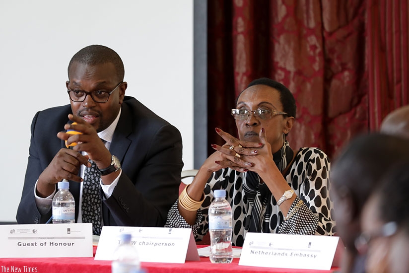 Prosecutor General Jean-Bosco Mutangana (left) speaks as Transparency International Rwanda head Marie-Immaculee Ingabire looks on. (Photos by Timothy Kisambira)