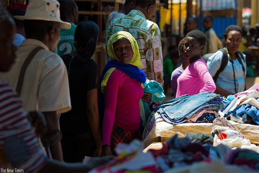 Residents buy secondhand clothes in Gahanga market in Kicukiro District. T. Kisambira