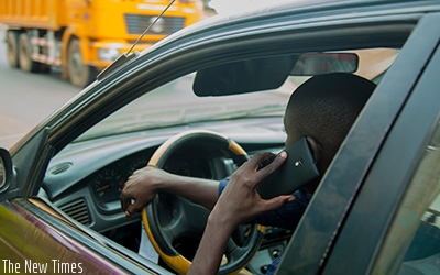 Rwanda National Police recently announced new stringent fines for drivers caught using mobile phones while driving. Faustin Niyigena.