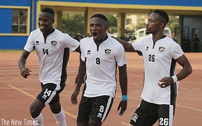 Djihad Bizimana (c) celebrates with his teammates Rugue Byiringiro (#14) and Issa Bigirimana as APR thumped Anse Ru00e9union in Kigali yesterday. Samuel Ngenadahimana.
