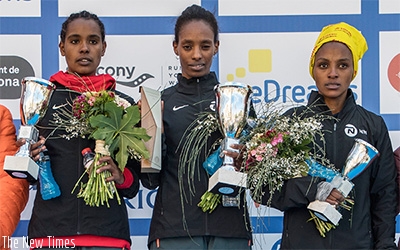 Nyirarukundo (right) shares a podium photo with Behrainu2019s Daba Tejitu (middle) and Ethiopiau2019s Kuma Dibabe (left) on Sunday in Barcelona. Courtesy.