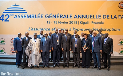 President Kagame in a group photo with some of the delegates attending the 42nd General Assembly of the Federation of African National Insurance Companies in Kigali yesterday. Vill....