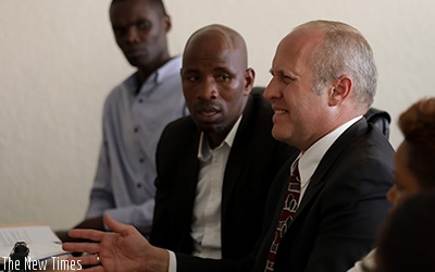 Amazing Grace Radio proprietor  (right) Gregory Ryan Shoof explains himself before Rwanda Media Commission  yesterday. Timothy Kisambira. 