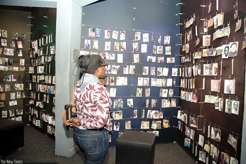 A woman looks at pictures of victims of the 1994 Genocide against the Tutsi at Kigali Genocide Memorial Centre. File.