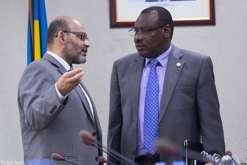 Yasser El Gammal, the World Bank Country Manager for Rwanda, chats with Finance minister Claver Gatete at a past event. Timothy Kisambira.