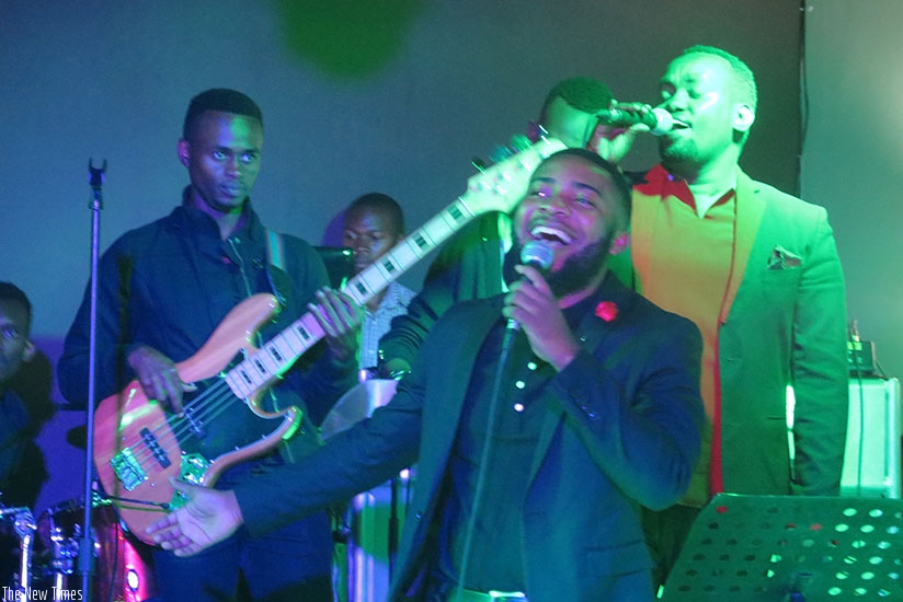 Hope and Mucyo (behind) perform for couples on Valentineu2019s Day. rn