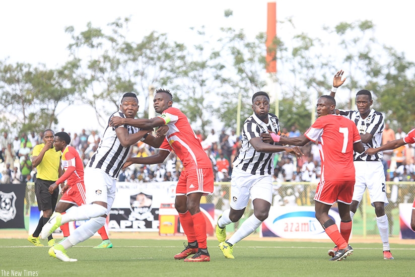 Musanze skipper, Peter Otema vs APR center defender, Aimable Nsabimana. Samuel Ngendahimana.
