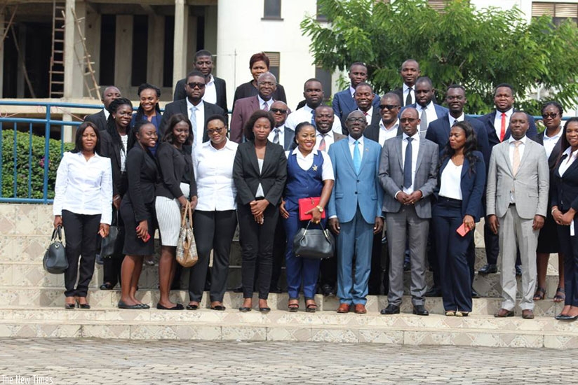 Karera (7th left, front row), and the ILPD rector, Dr Didas Kayihura (4th right), in a group photo with Ghanaian students undertaking a diploma course at the Nyanza-based instituti....