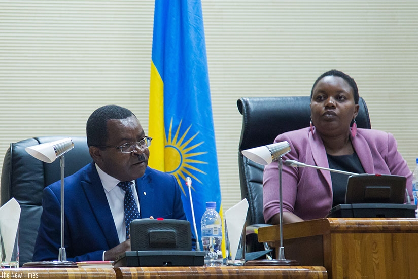 The Minister for Trade and Industry, Vincent Munyeshyaka, addresses parliamentarians as the Deputy Speaker in charge of Legislation, Jeanne du2019Arc Uwimanimpaye, looks on yeste....