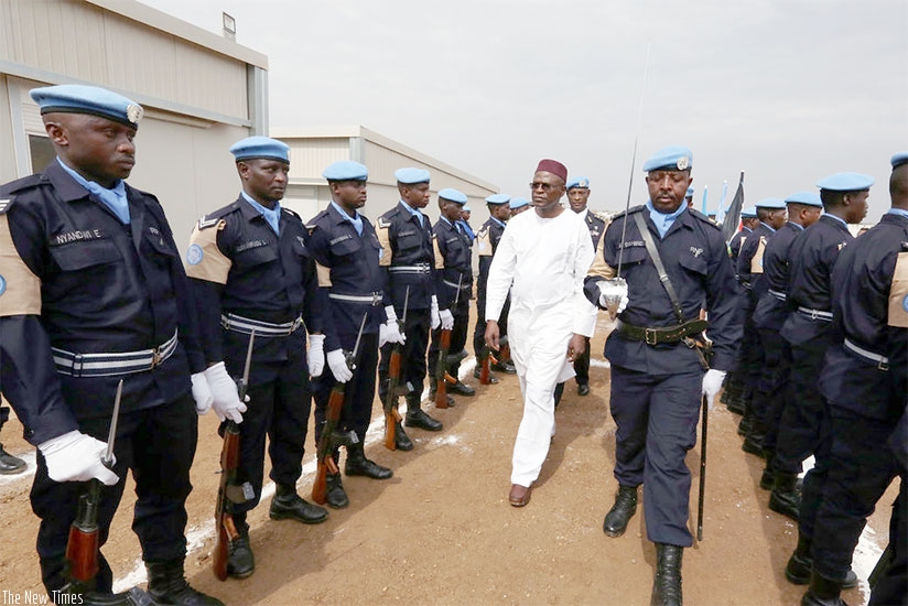 Moustapha Soumaru00e9, Deputy Head of the peacekeeping mission, inspects the medal parade mounted by Rwanda police peacekeepers in Juba on Monday. Courtesy.