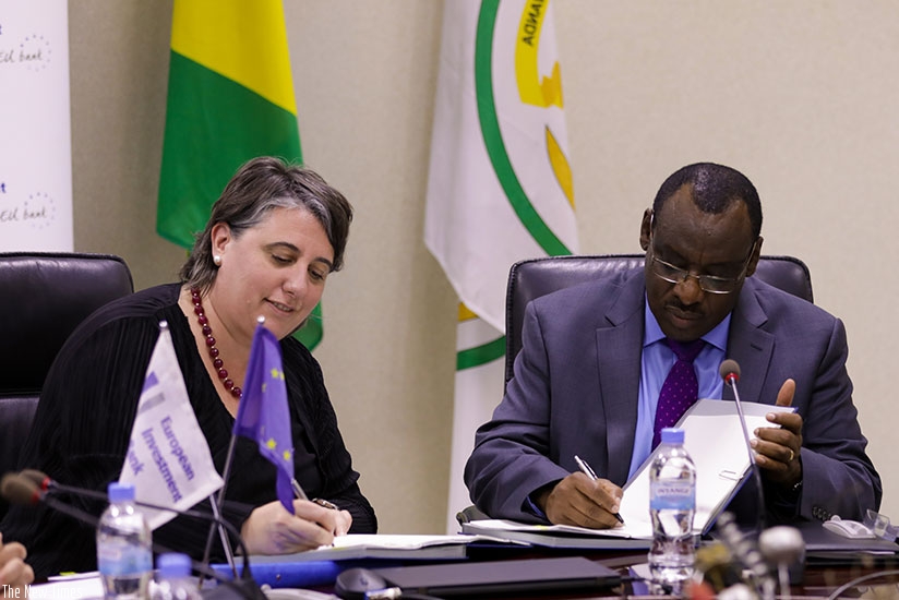 Finance and Economic Planning minister Claver Gatete, and Maria Shaw-Barragan, the European Investment Bank director for lending operations outside Europe, sign the financing deal ....