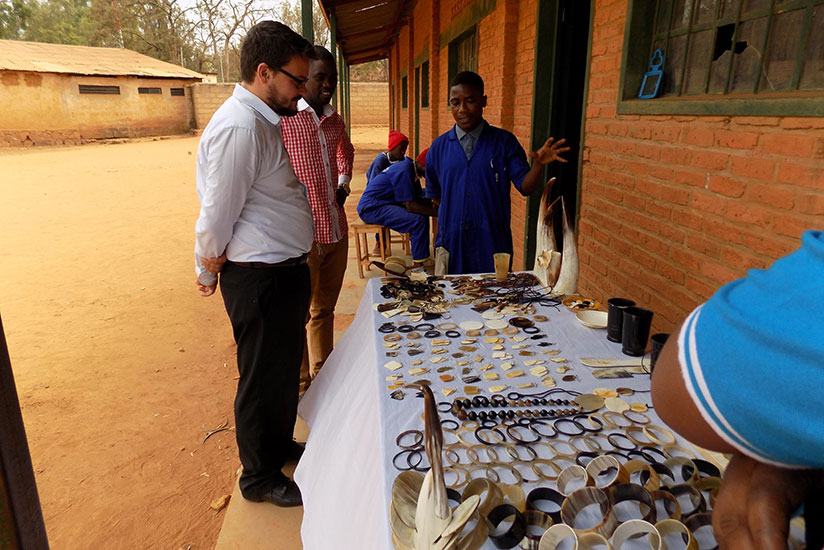 A group of students from Groupe Scolaire   Kicukiro taking part in the programme explain how they make jewels from cow corns. / Diane Mushimiyimana.