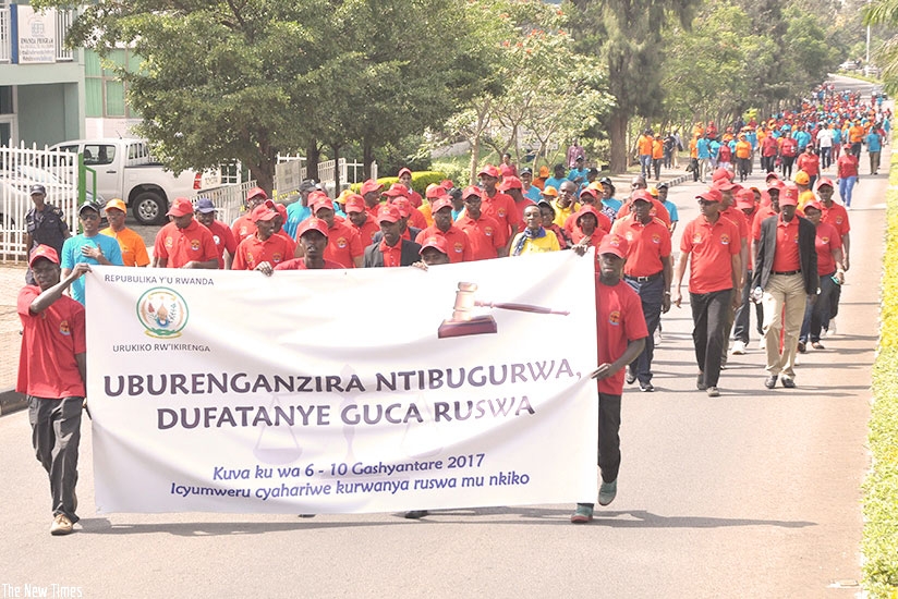 Personnel in judiciary march during the anti-corruption campaign last year. File.