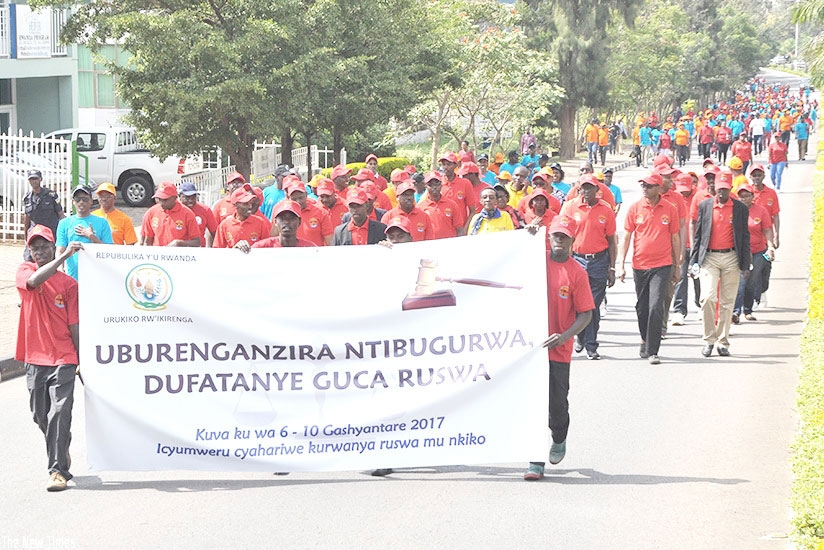 Personnel in judiciary march during an anti-corruption campaign last year. File.