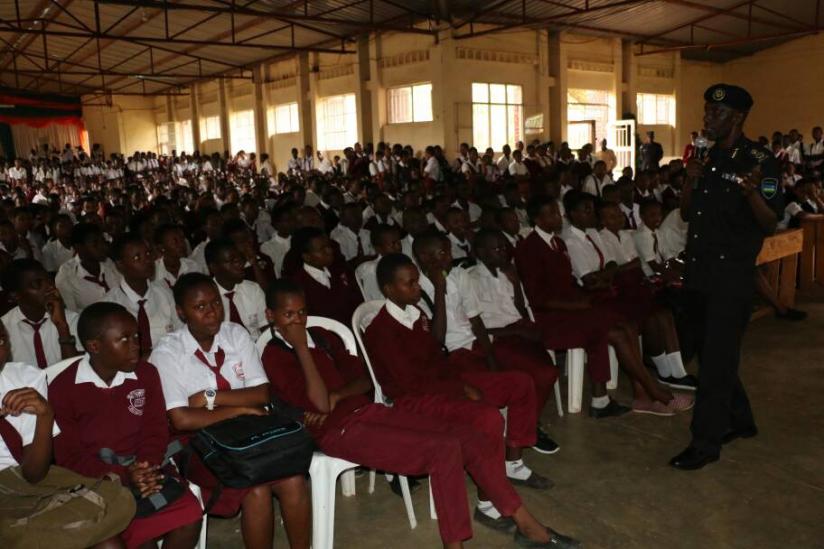 ACP Damas Gatare addressing students of Ecole Camp Kigali.