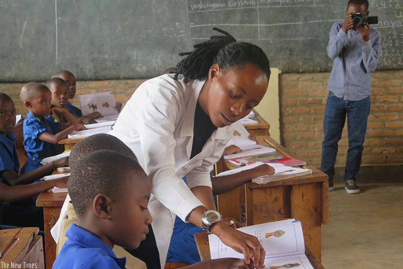 A teacher engages students in a lesson as EDT officials toured to assess the challenges facing teachers during their teaching practices. Eddie Nsabimana.