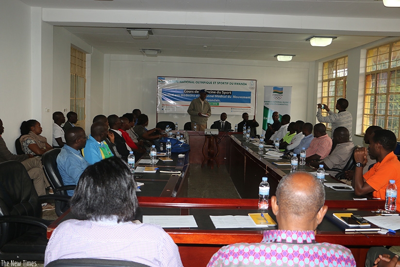 RNOSC president Ambassador Valens Munyabagisha addressing participants on the first day of the Sports Medicine course on Friday. D. Sikubwabo.